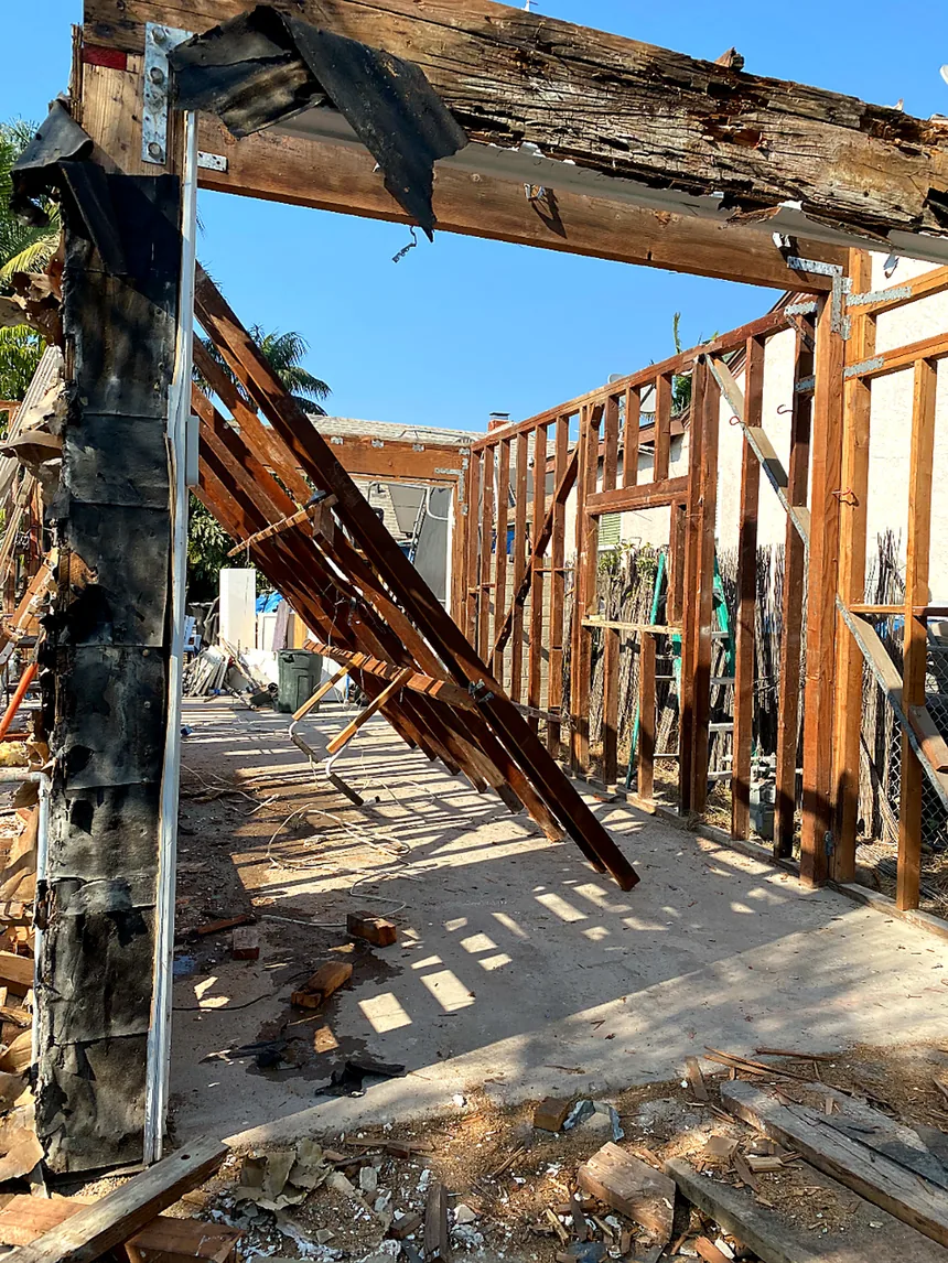 Open wall framing and structural posts during reconstruction