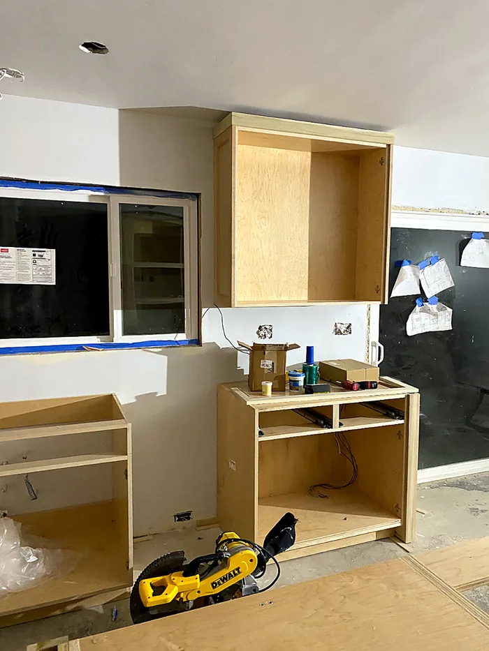 Custom cabinet installation during a kitchen construction project